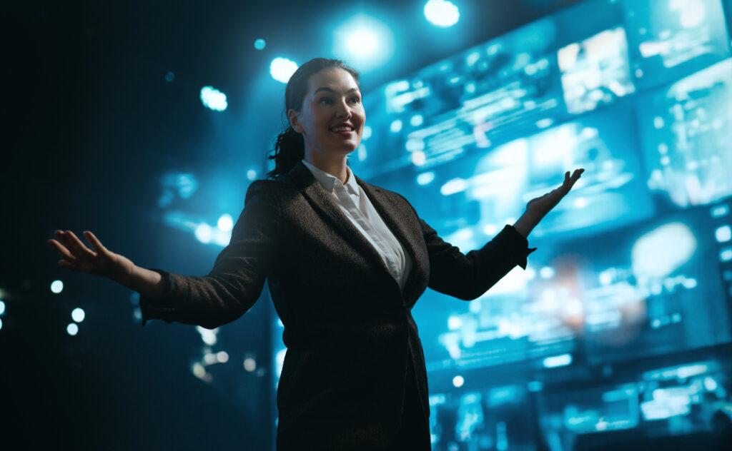 a woman is speaking on stage