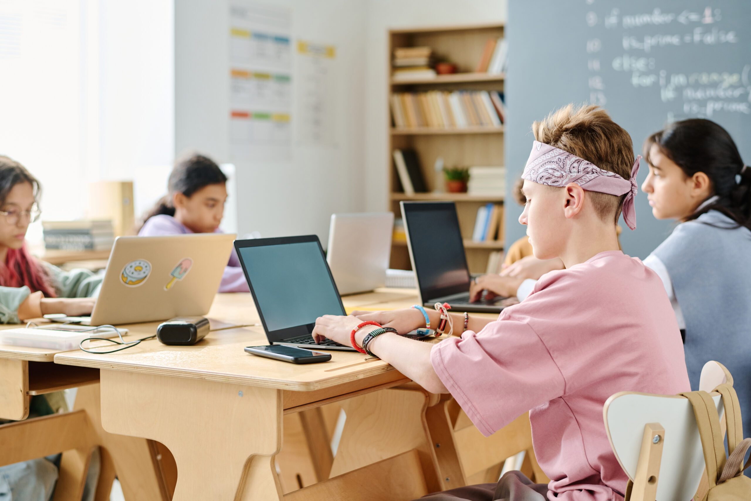 Home school children using computers at lesson